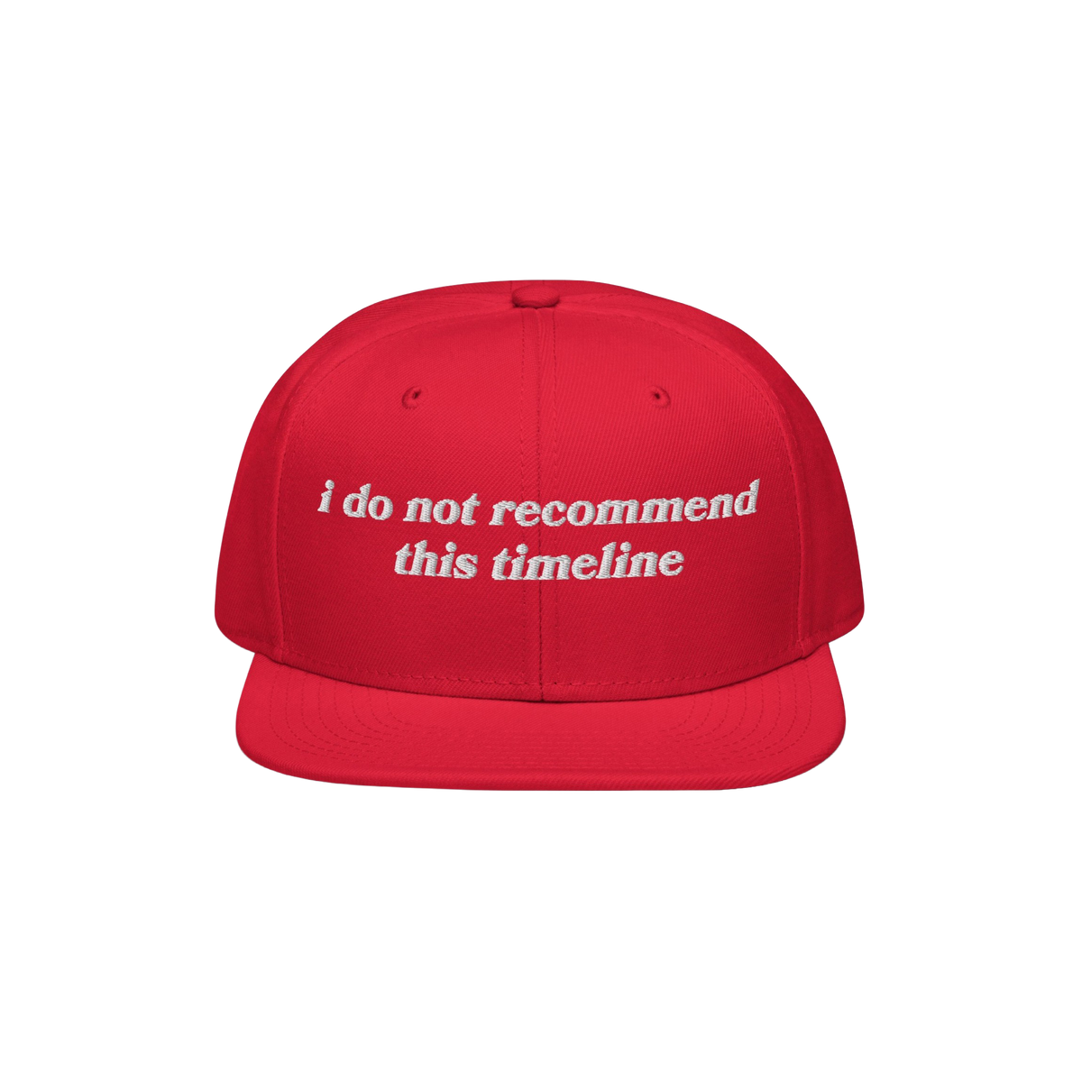 Red snapback cap with flat brim featuring white embroidered text reading “i do not recommend this timeline.” Ideal for ir