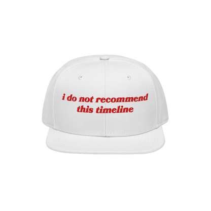 White flat-brim cap with red embroidered text, I Do Not Recommend This Timeline, capturing sarcasm and resilience. Ideal for 