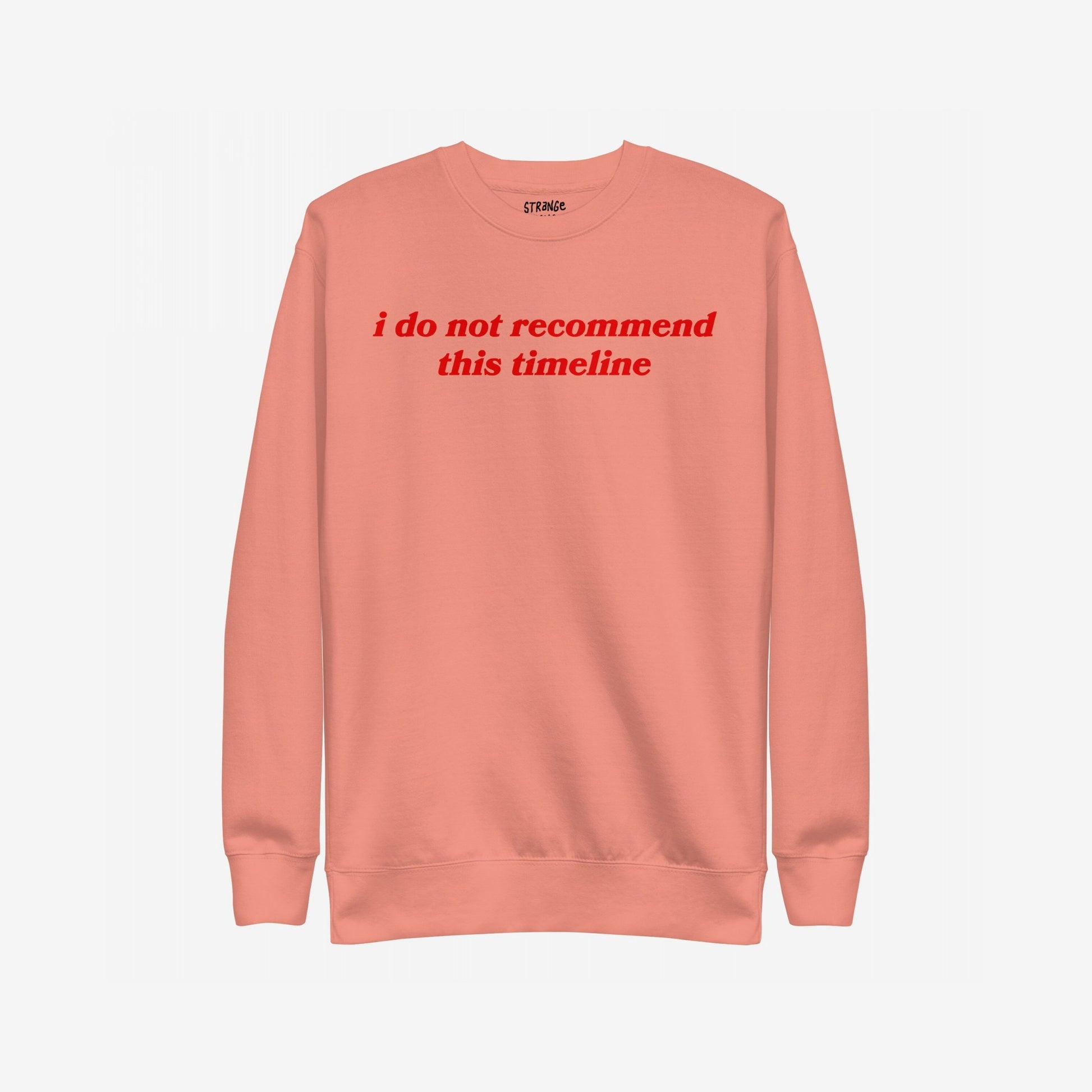 Timeline Sweatshirt EU with bold red italic text reading “i do not recommend this timeline” across the chest; a midweight crewneck for those embracing dry humor and societal critique.